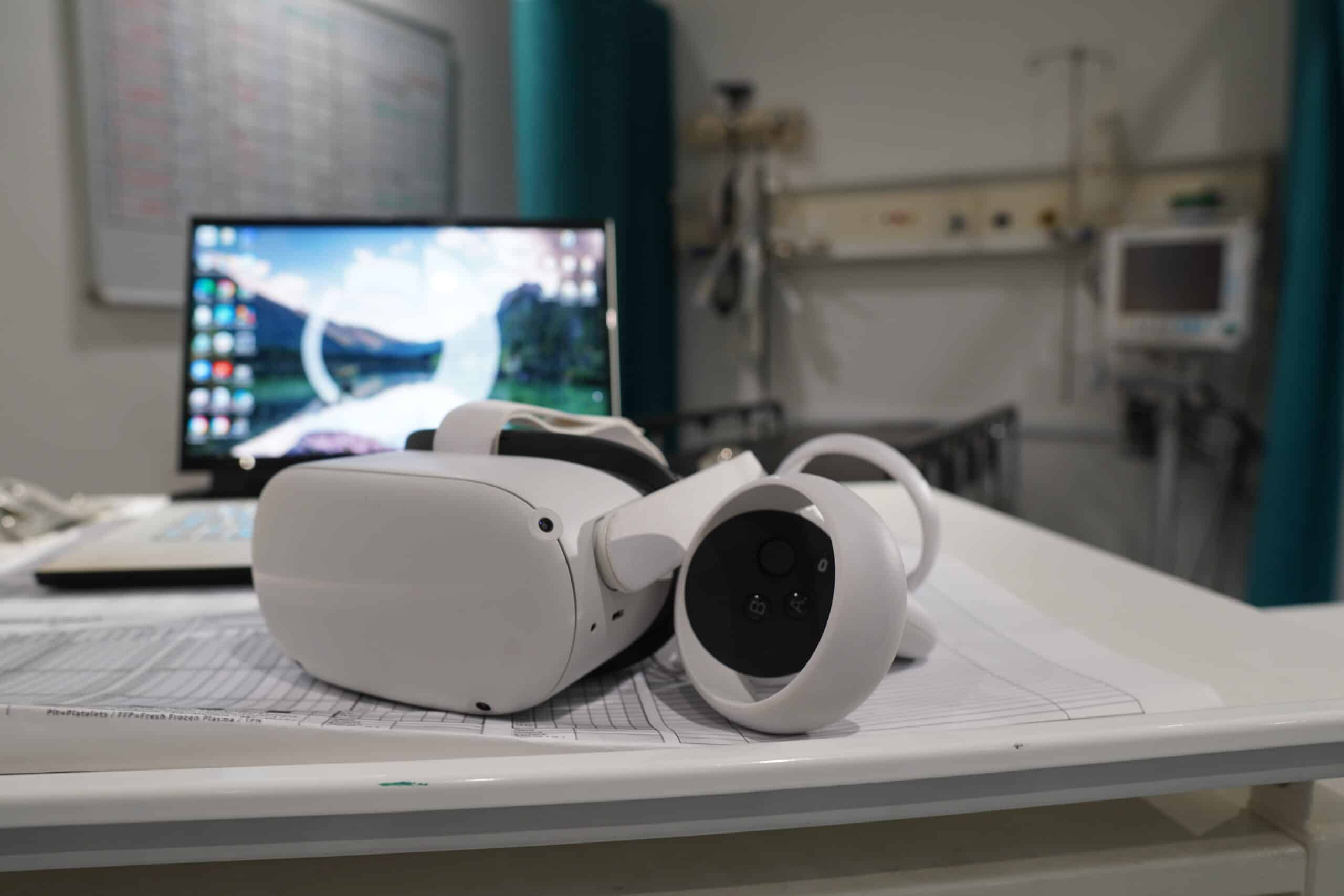 VR headset on desk with laptop