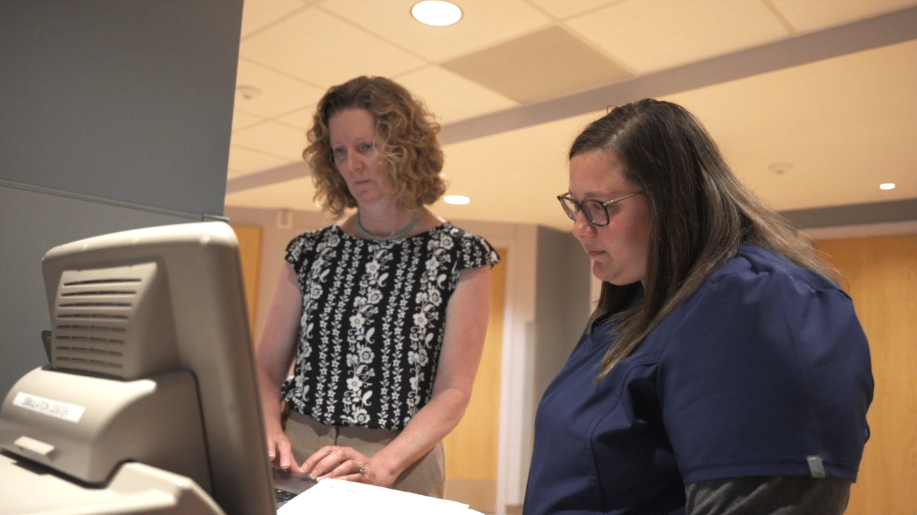 Healthcare team members reviewing on desktop