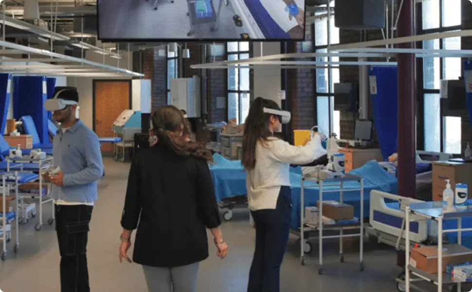 Students practicing clinical skills together in a VR medical simulation lab