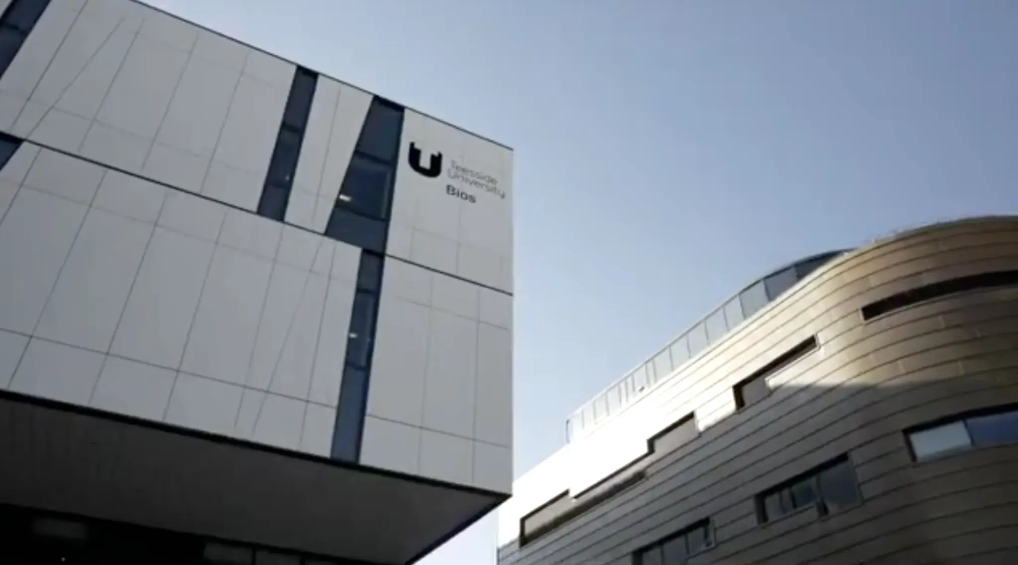 Exterior shot of the University of Birmingham Biosciences building, highlighting contemporary academic architecture against a clear sky.