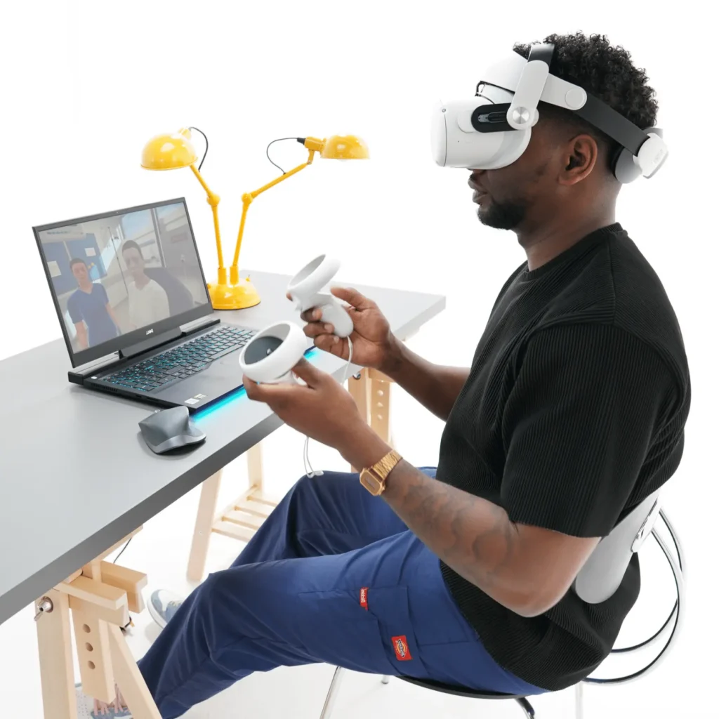 Healthcare professional in a headset interacting with the OMS VR medical training desktop app.