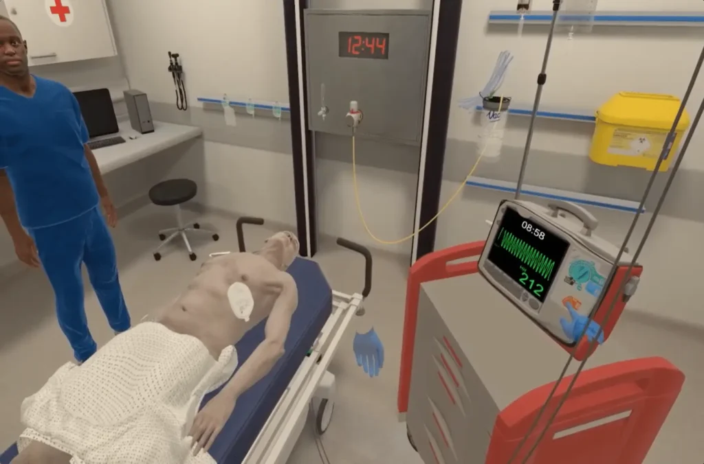 Nursing station and patient bed setup for OMS VR medical training simulation.